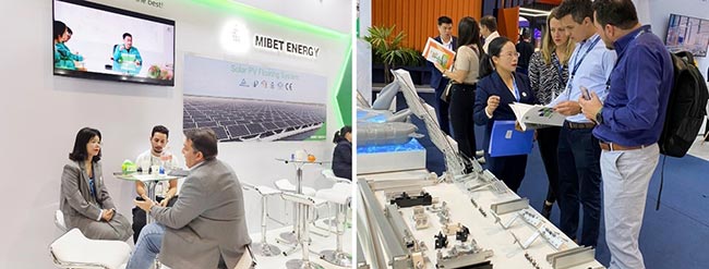 Invitados aprendiendo sobre productos de montaje solar en el stand de Mibet